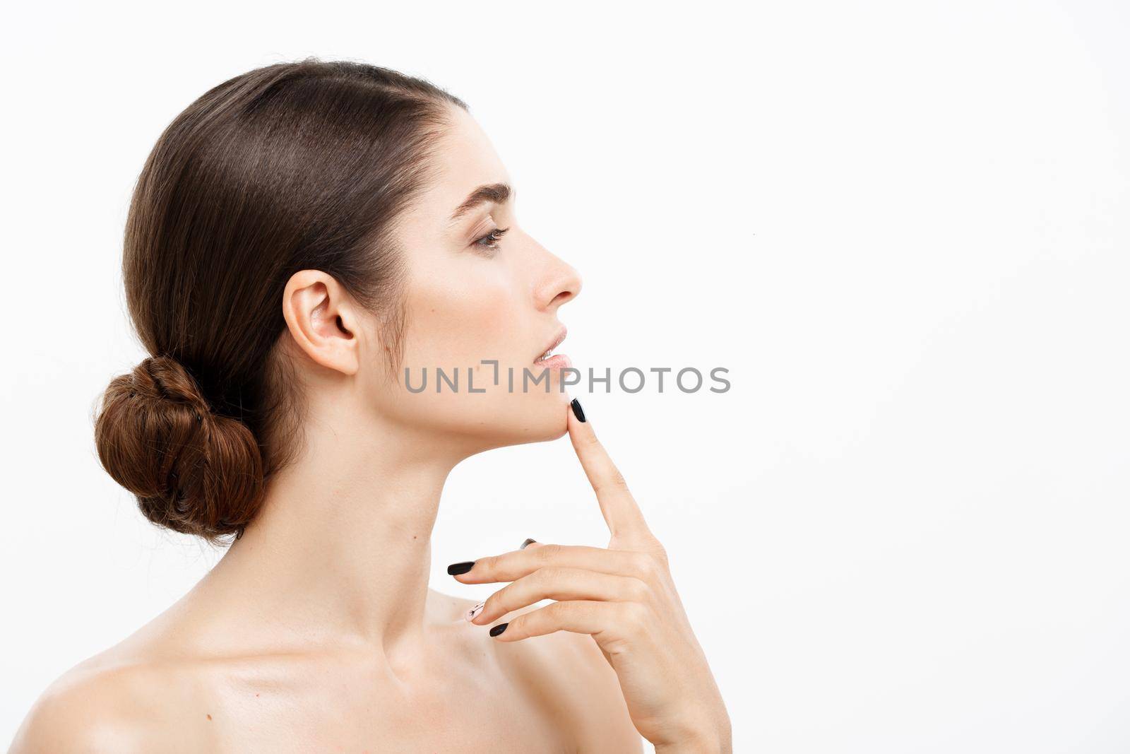 Beauty Skin Care Concept - Beautiful caucasian woman face portrait touching her chin with finger shocked and worried with acne isolated on white. by Benzoix