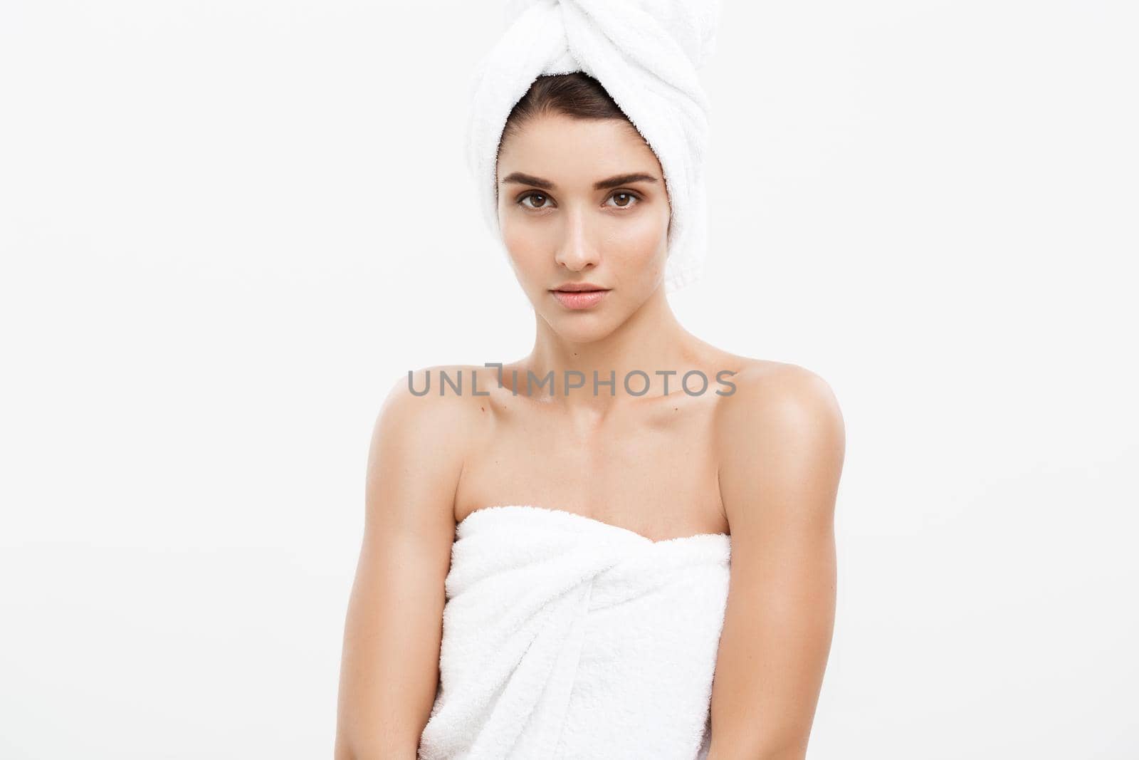 Beauty and Skin care concept -Beautiful caucasian young woman wearing towel after shower.