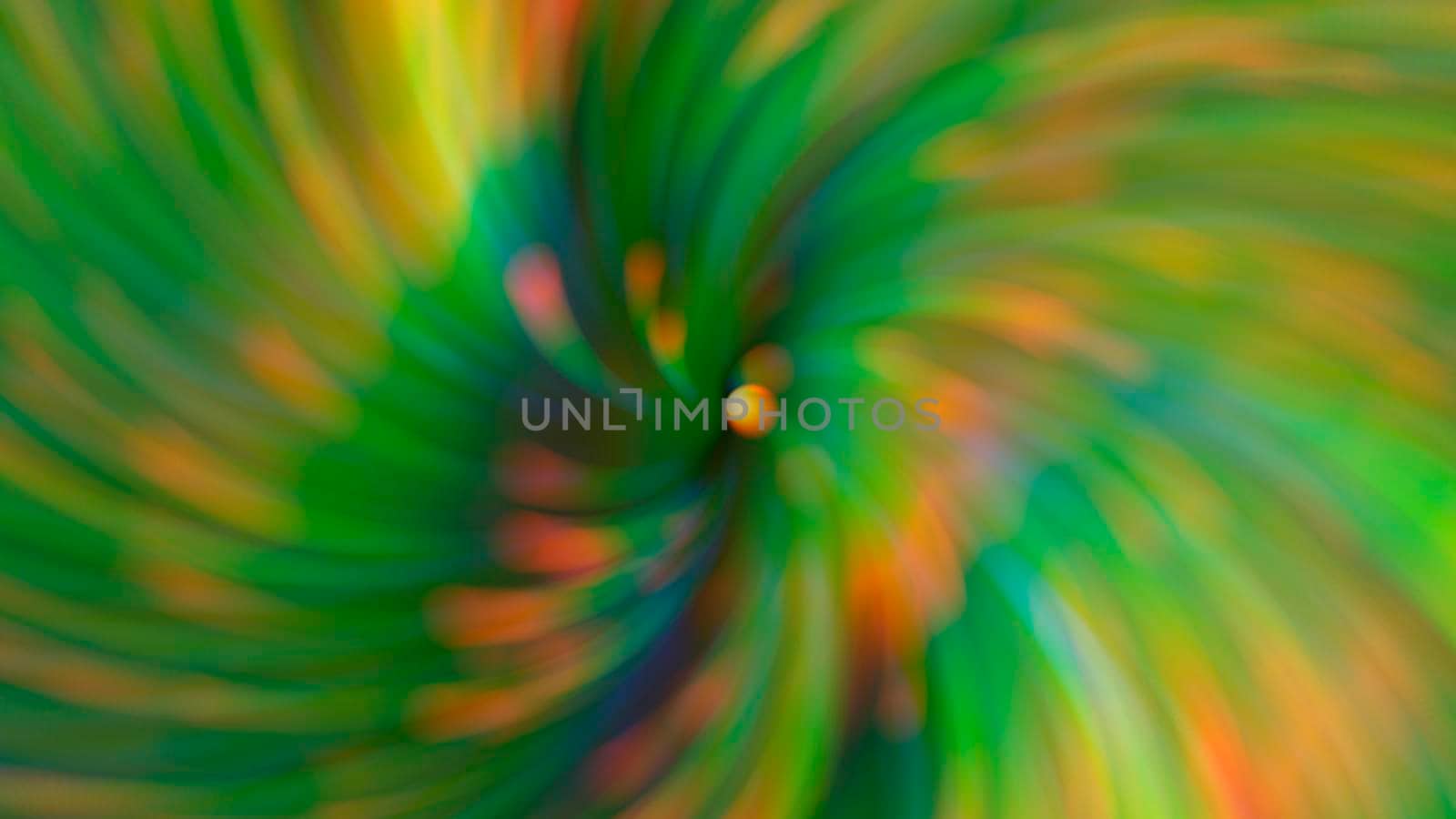 Abstract blurry green background with rainbow highlights.