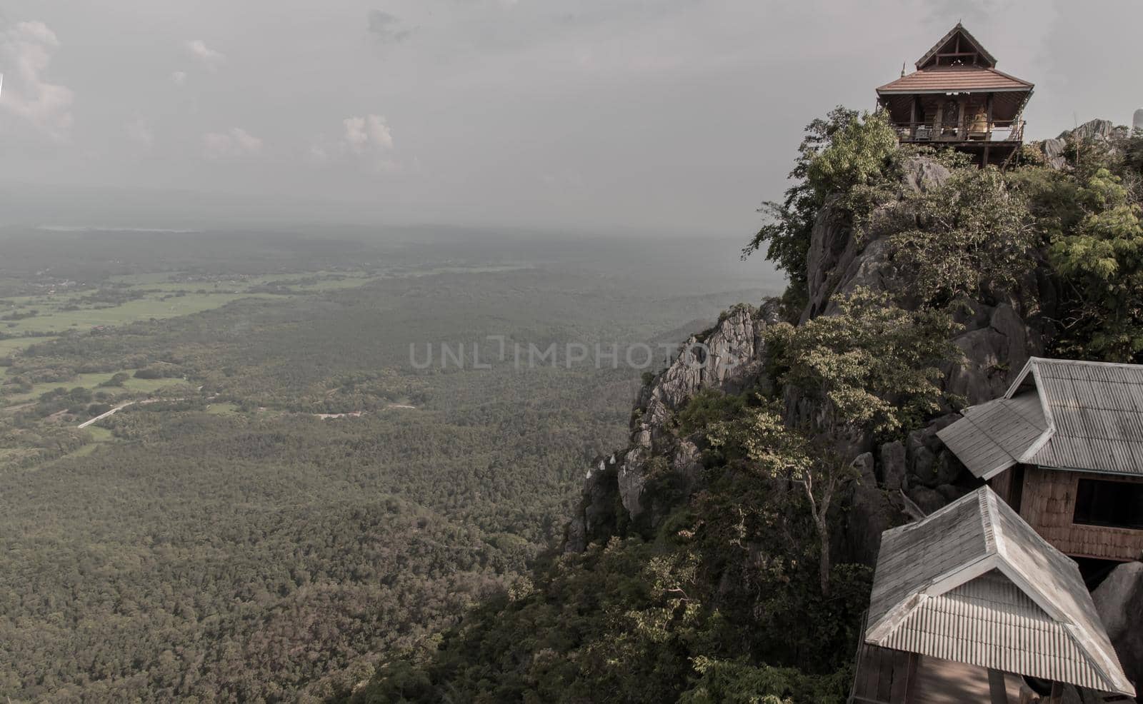 Lampang, Thailand - Sep 03, 2020 : Pagoda on top of the cliff high mountain at Chaloem Phrakiat Phrachomklao Rachanuson temple (Wat Phrabat Pu Pha Daeng) Chae-Hom District, Lampang province, Unseen and Amazing temple in Thailand. Selective focus.