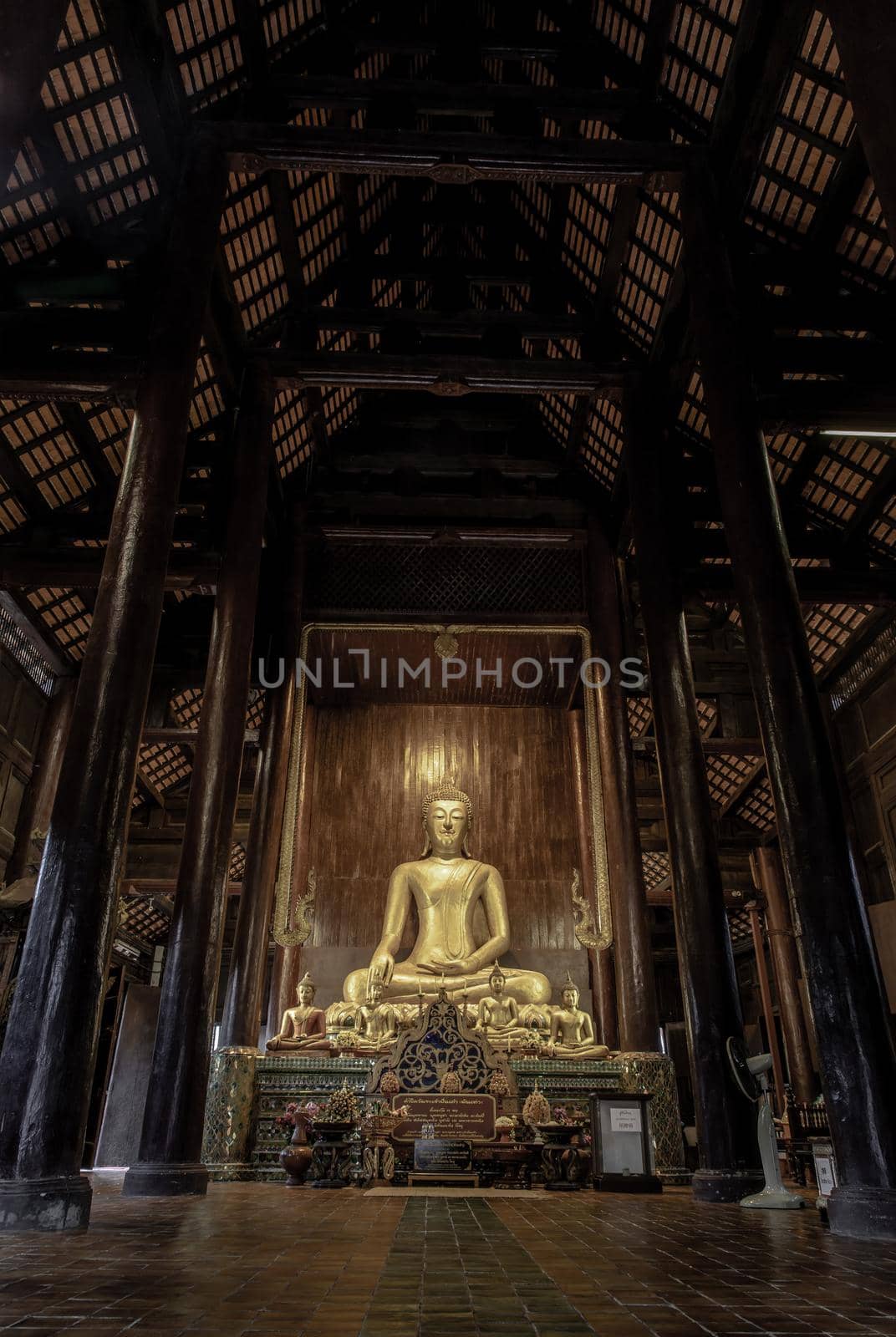 Chiangmai, Thailand - Sep 07, 2020 : The buddha image in main vihan at wat phun tao. Wat phan tao is a beautiful wooden temple in chiang mai. Selective focus.