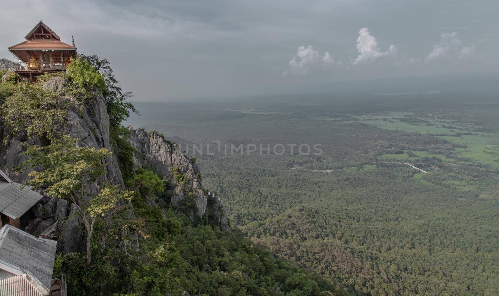 Lampang, Thailand - Sep 03, 2020 : Pagoda on top of the cliff high mountain at Chaloem Phrakiat Phrachomklao Rachanuson temple (Wat Phrabat Pu Pha Daeng) Chae-Hom District, Lampang province, Unseen and Amazing temple in Thailand. Selective focus.
