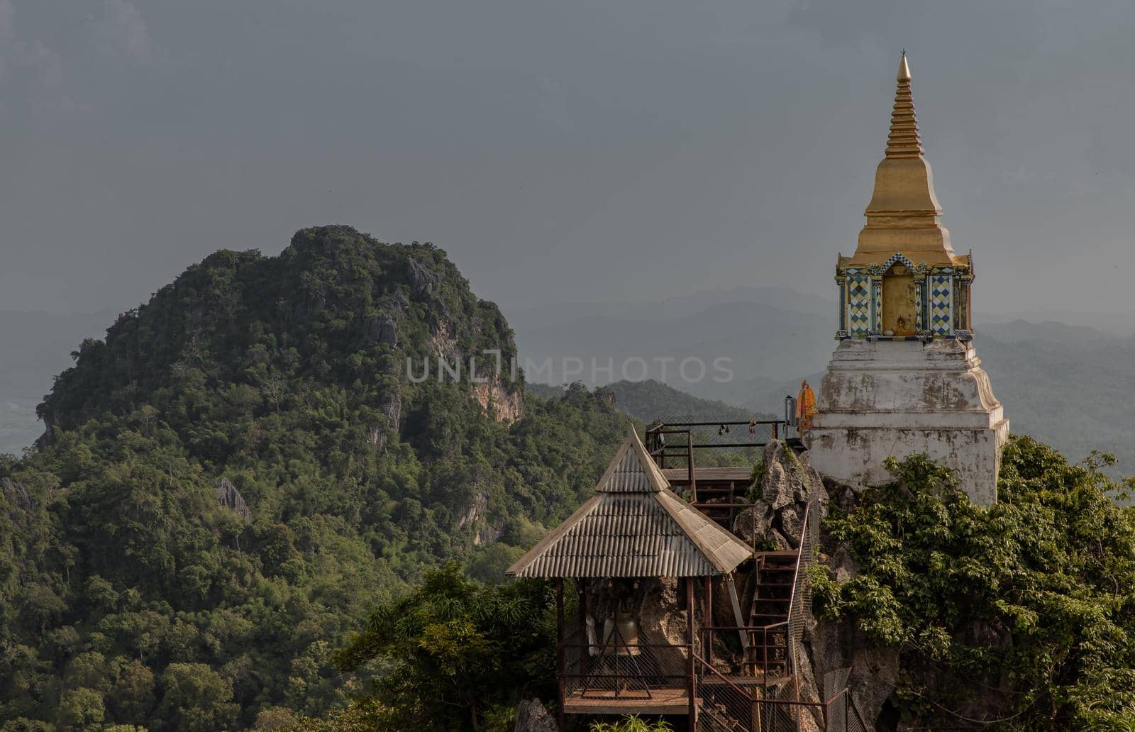 Lampang, Thailand - Sep 03, 2020 : Pagoda on top of the cliff high mountain at Chaloem Phrakiat Phrachomklao Rachanuson temple (Wat Phrabat Pu Pha Daeng) Chae-Hom District, Lampang province, Unseen and Amazing temple in Thailand. Selective focus.