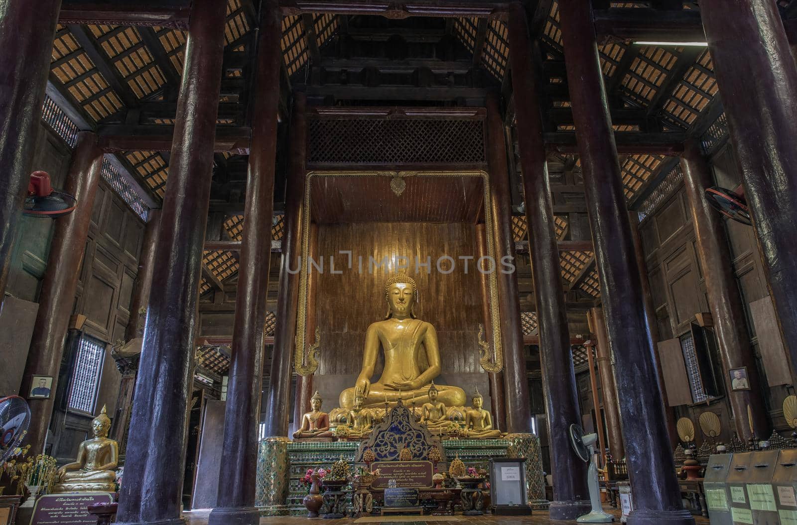 Chiangmai, Thailand - Sep 07, 2020 : The buddha image in main vihan at wat phun tao. Wat phan tao is a beautiful wooden temple in chiang mai. Selective focus.