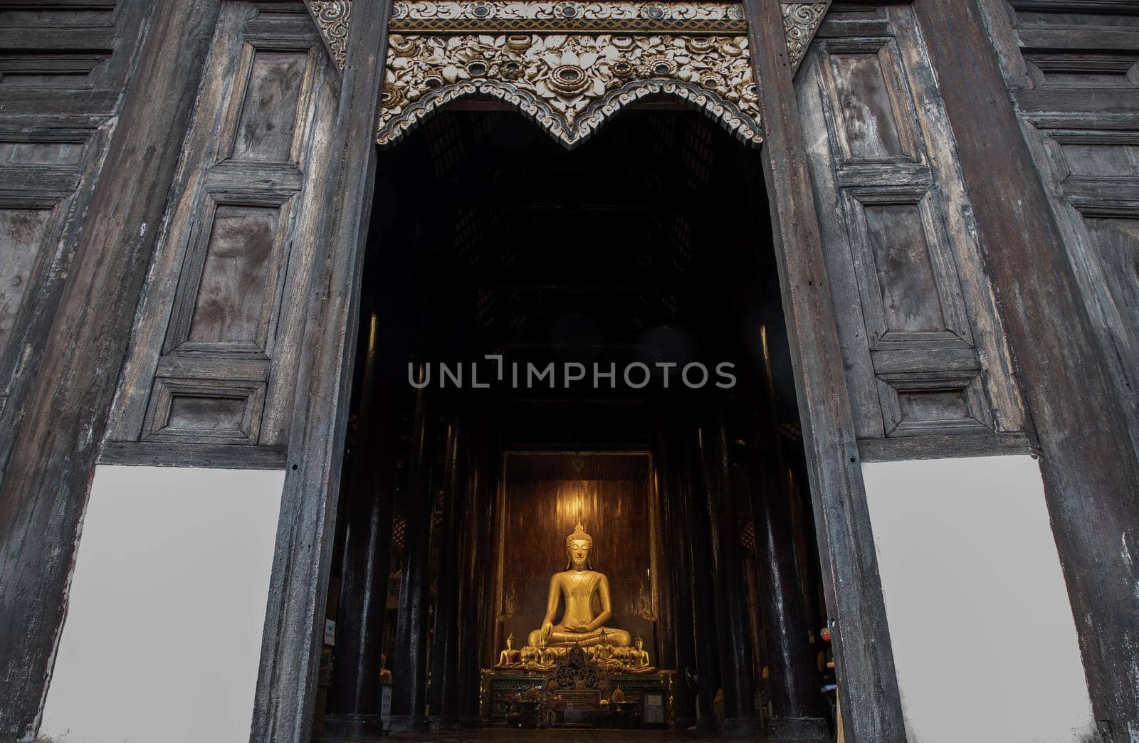 Chiangmai, Thailand - Sep 07, 2020 : The buddha image in main vihan at wat phun tao. Wat phan tao is a beautiful wooden temple in chiang mai. Selective focus.