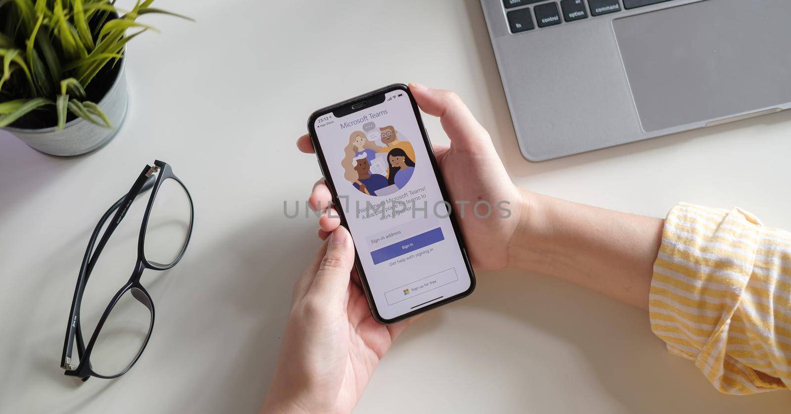 CHIANG MAI, THAILAND - JULY 3, 2020 : A working from home employee is downloading the Microsoft Teams social platform, ready for remote working in isolation from home