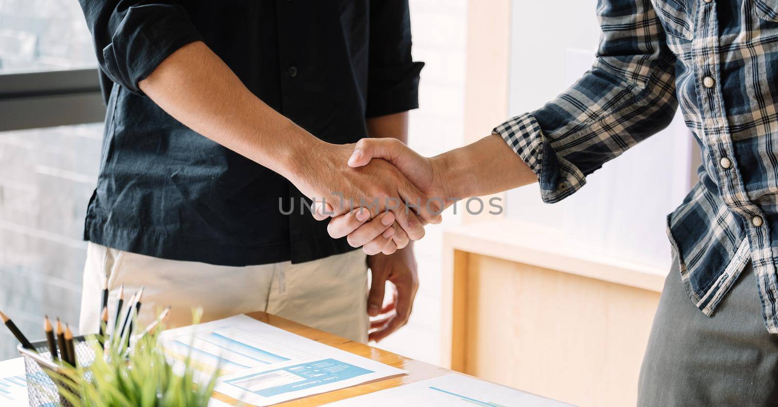 business people handshake for teamwork of business merger and acquisition by nateemee