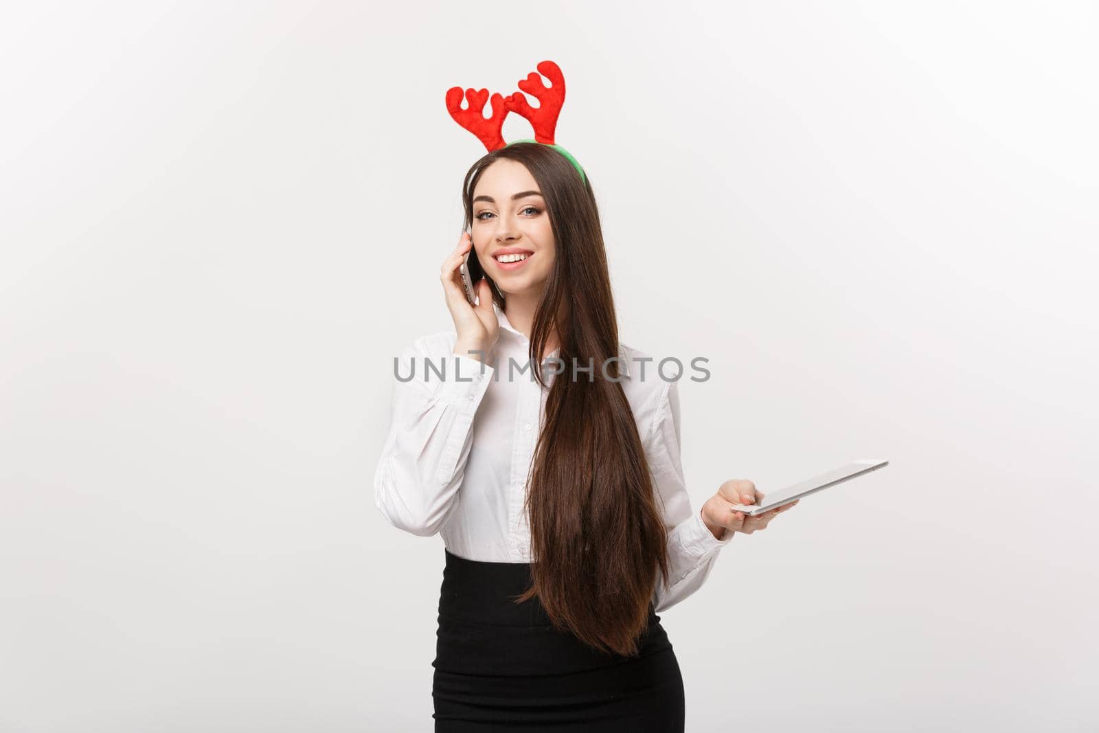 Business Concept - young caucasian business woman talking onmoblie phone with happy facial expression.