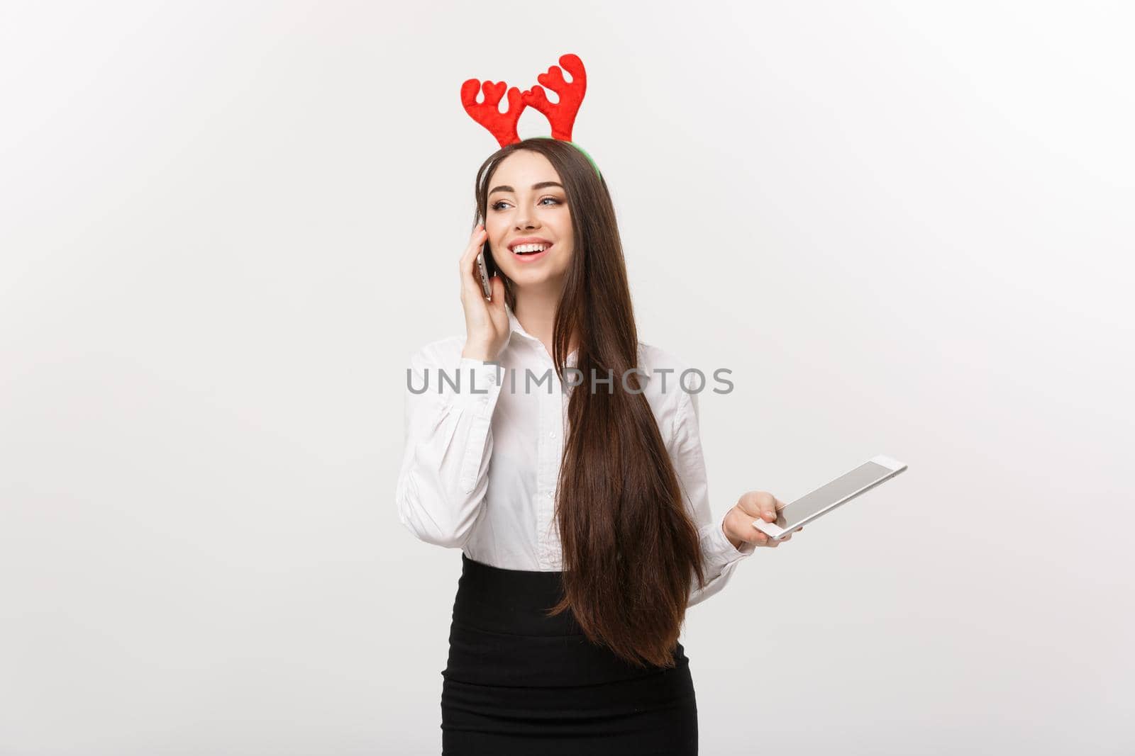 Business Concept - young caucasian business woman talking onmoblie phone with happy facial expression.