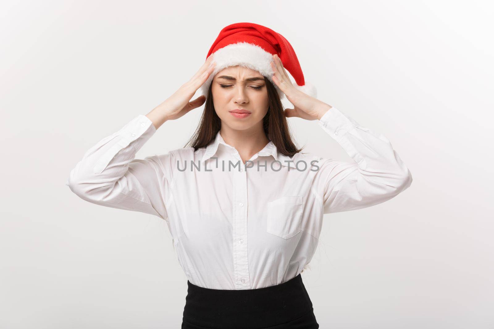 Business Concept - Modern caucasian business woman in christmas theme with serious thoughtful pose.