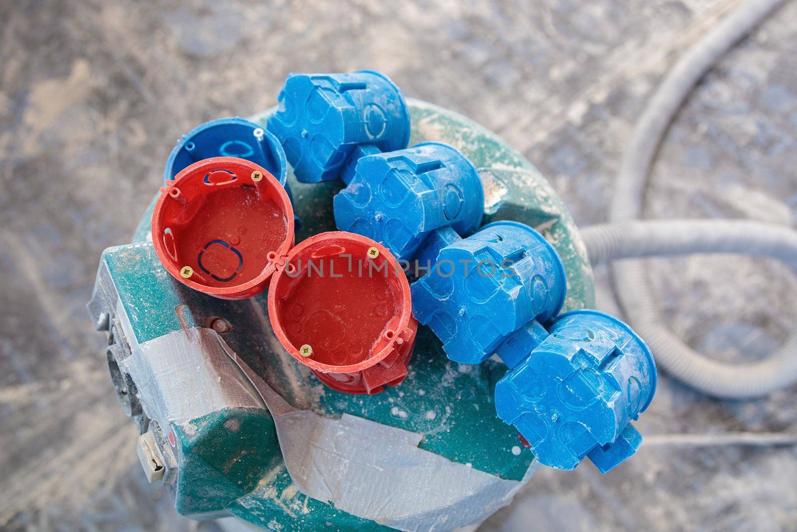 A set of plastic inserts for red and blue sockets. Construction vacuum cleaner