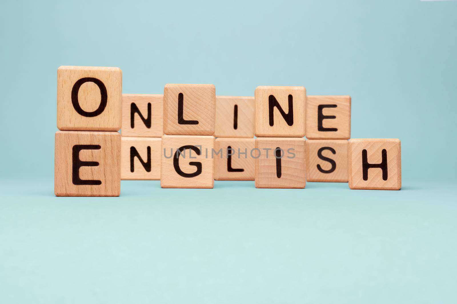 Word Online English letters blocks toy cubes. Speak English Online course icon wooden blocks concept foreign language tutoring. Learning Online English words block wooden cubes concept language course by synel