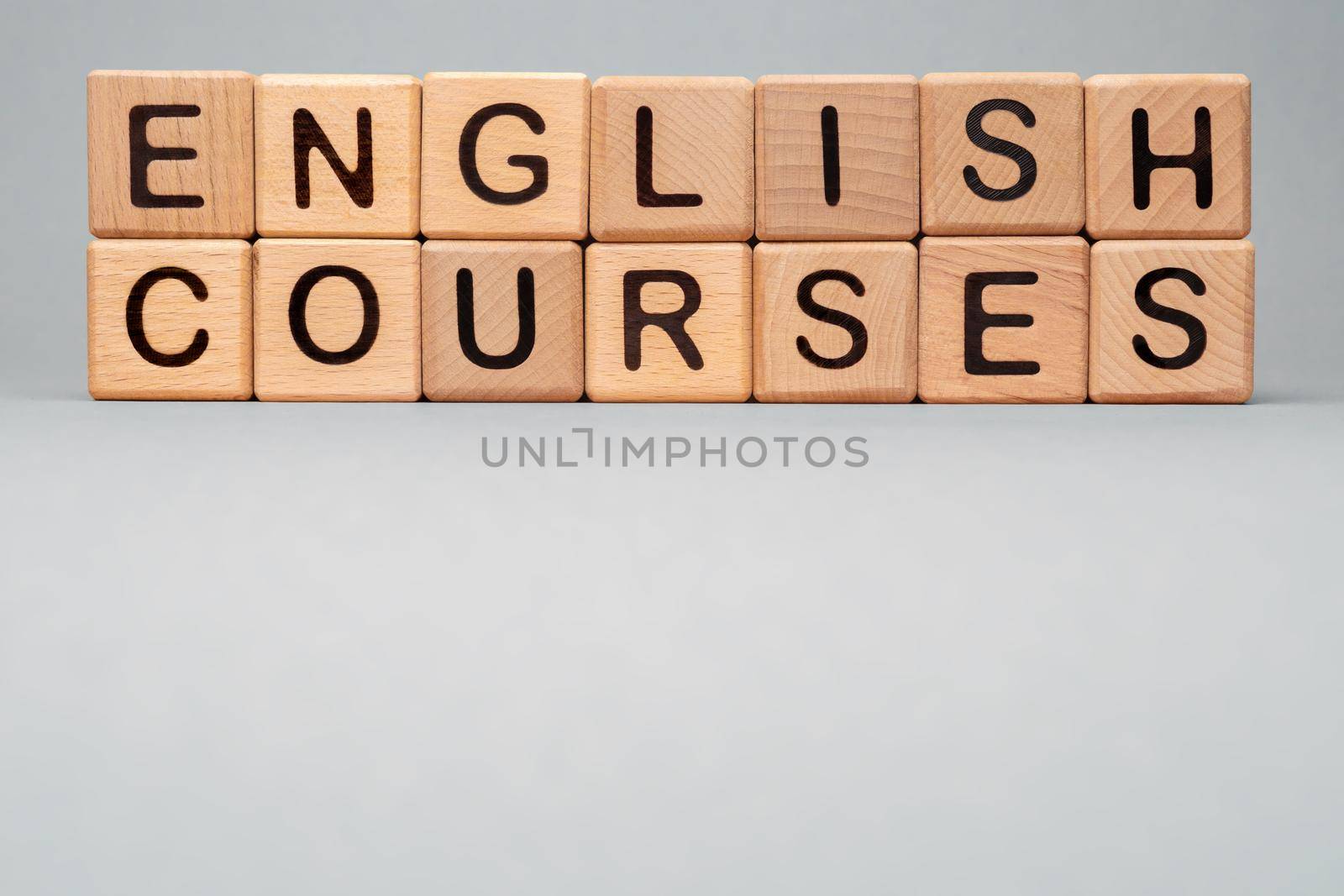 Language Courses English online learn icon cube. Wooden block toy cubes concept learning English Courses training. Speak English Courses icon words block wooden cubes concept foreign language tutoring by synel