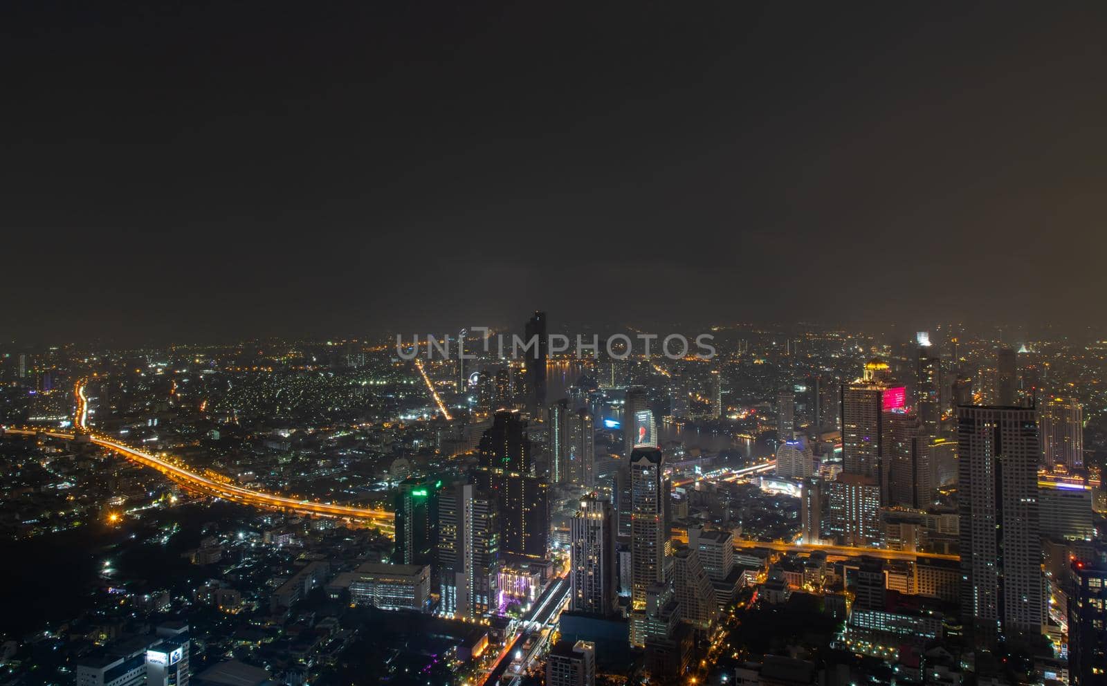 Bangkok, thailand - Nov 07, 2020 : Bangkok downtown cityscape with skyscrapers at night give the city a modern style. No focus, specifically.