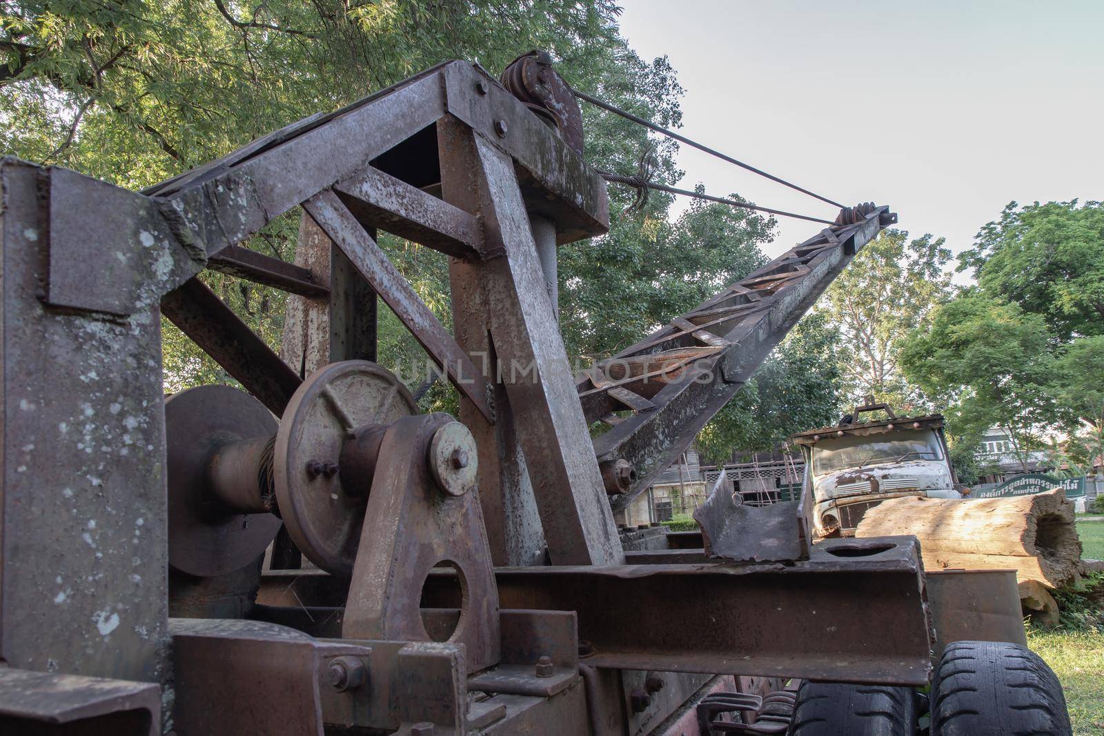Loading heavy industrial old logging truck machine. Parts of an old logging truck abandoned, select focus.
