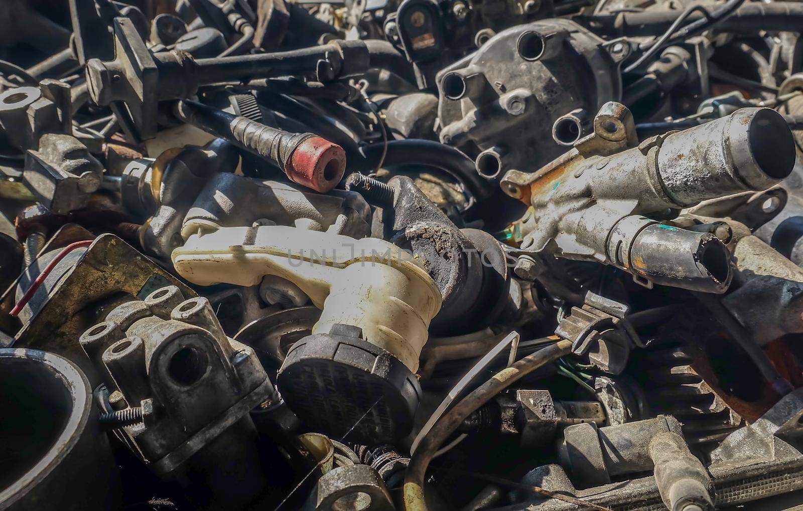 Close-up of Used and surplus car engines  & accessories of the car at the repair service garage. Selective focus.