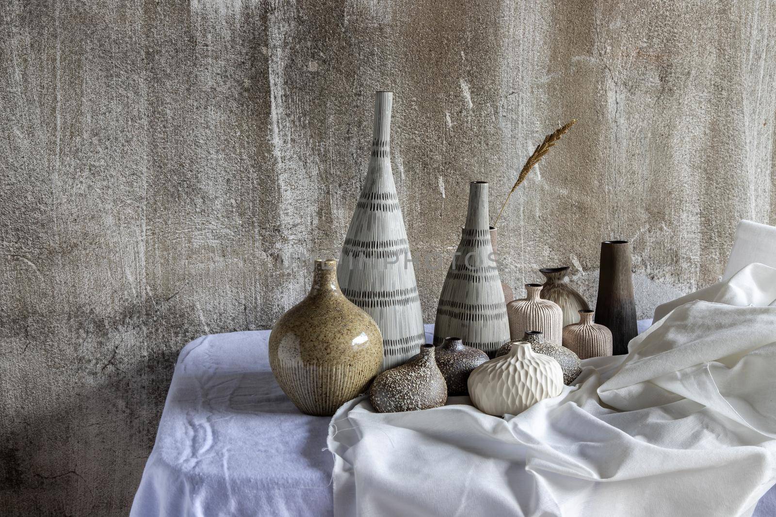 Handmade Assorted Many Different Ceramic Vases on white table. Home decor, Space for text.