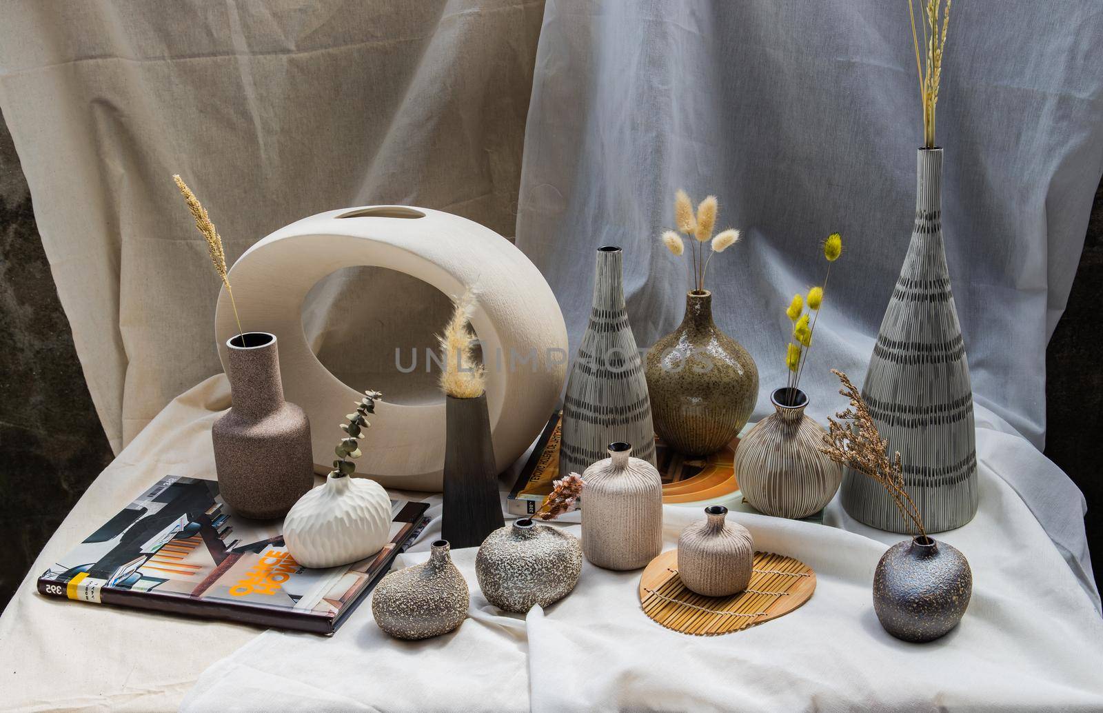 Bangkok, Thailand - Sep 26, 2020 : Handmade Assorted Many Different Ceramic Vases on white table. Home decor, Space for text.