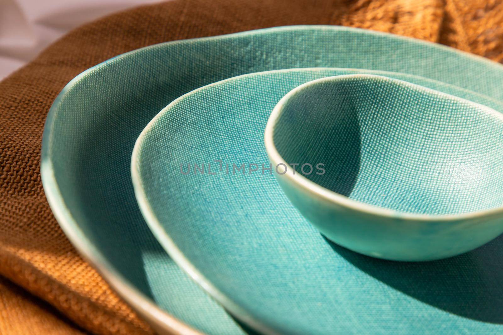 Detailed of Ceramic Plates on Sackcloth. Home decor, Ceramic tableware, Beautiful arrangement.