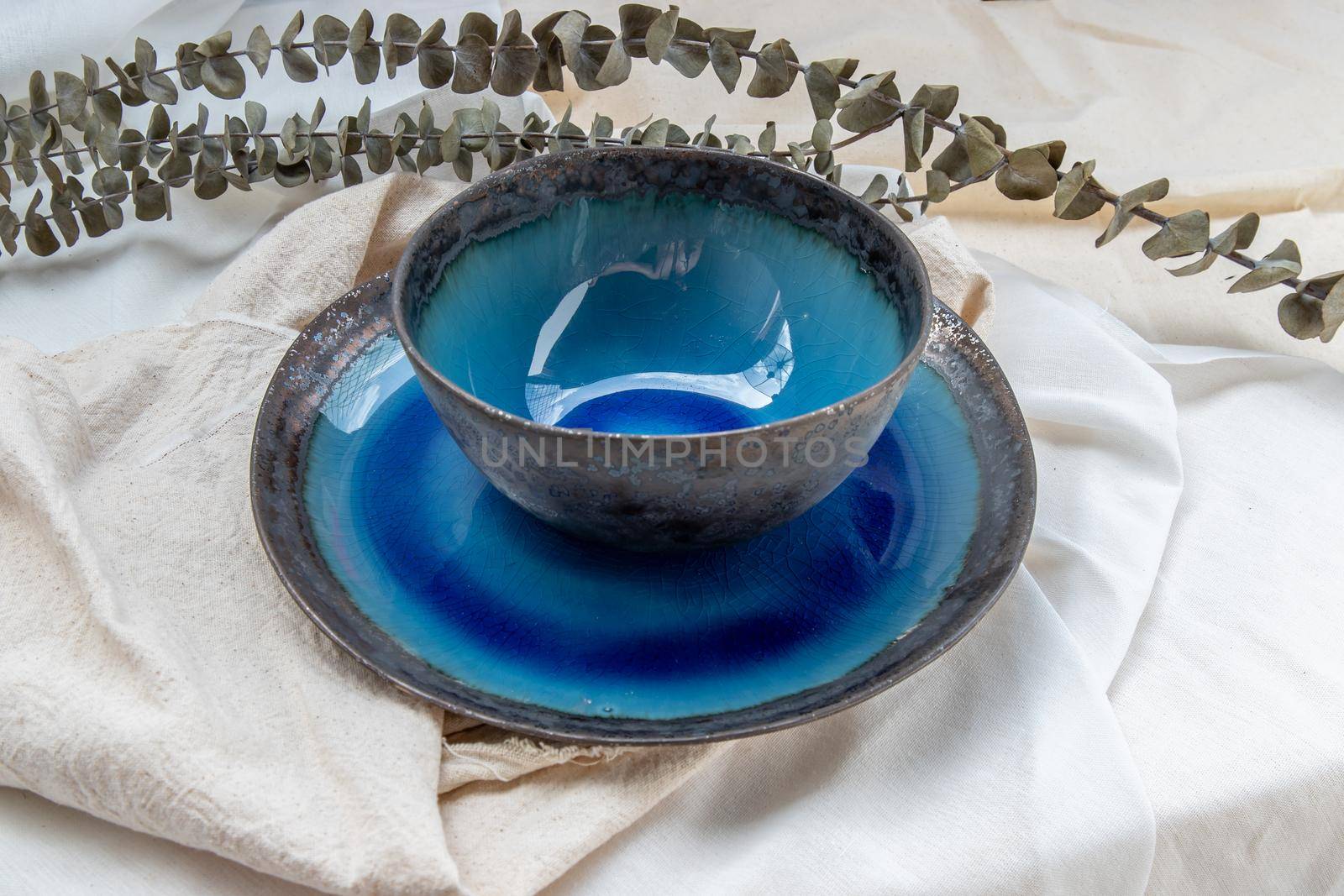 Set of Ceramic bowl with Dried flowers on Calico. Ceramic tableware, Beautiful arrangement.