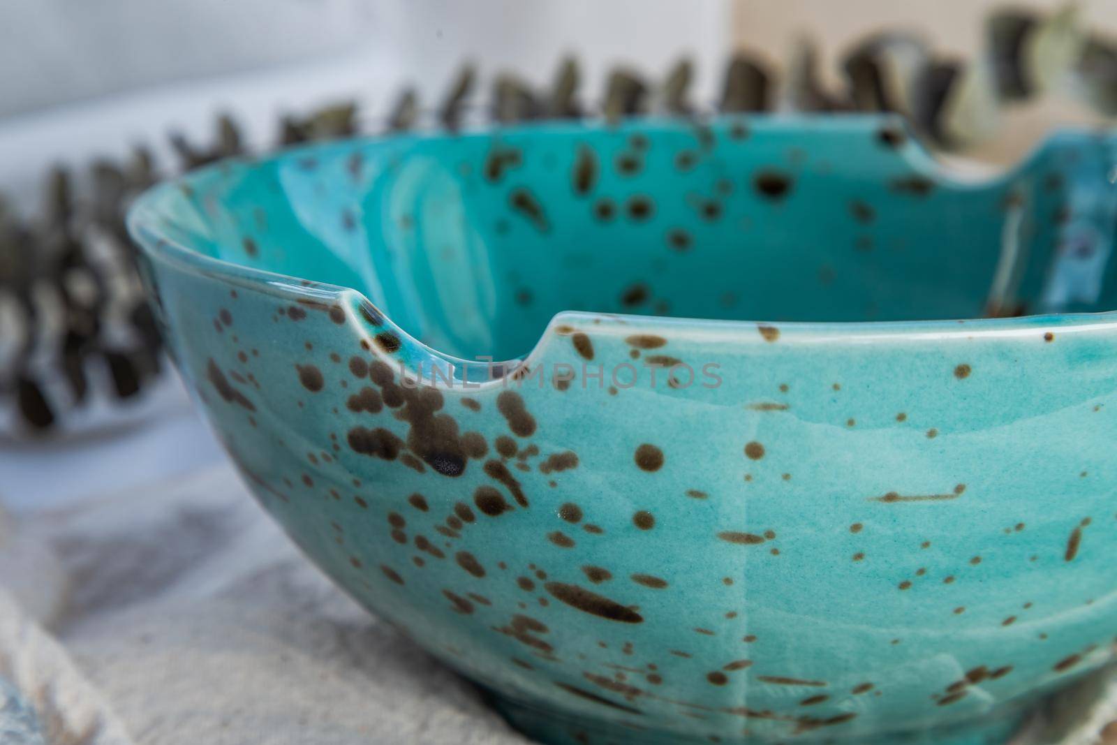 Details of ceramic bowl with Dried flowers on Calico. Beautiful arrangement.
