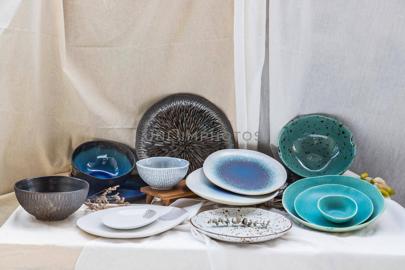Different Ceramic Plates and Bowl on Calico. Ceramic tableware, Beautiful arrangement.