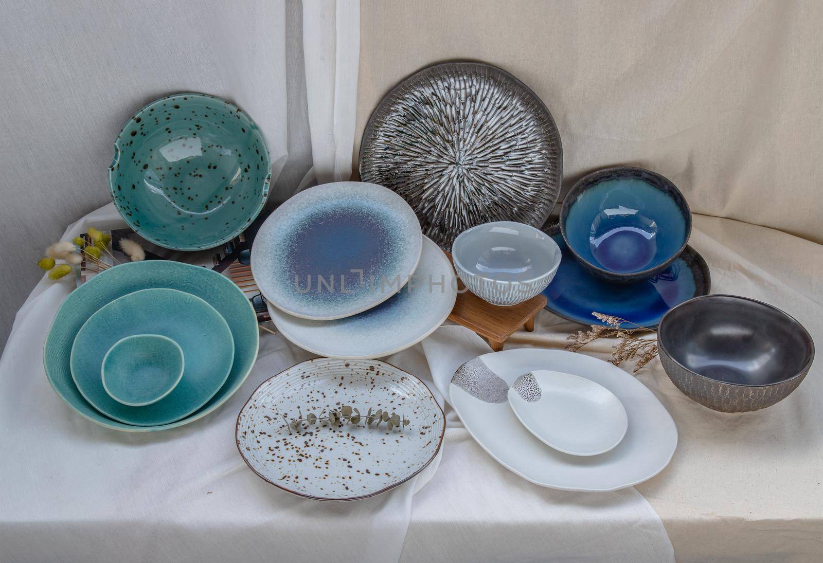 Different Ceramic Plates and Bowl on Calico. Ceramic tableware, Beautiful arrangement.