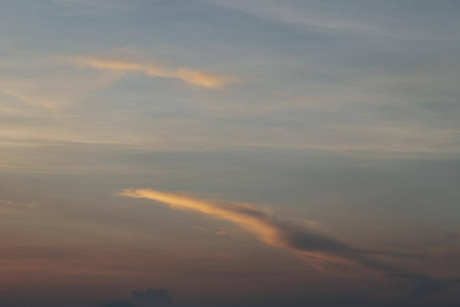 Beautiful sunset sky above clouds with dramatic light, Beautiful blazing sunset landscape, Horizon. Warm Colours, copy space.