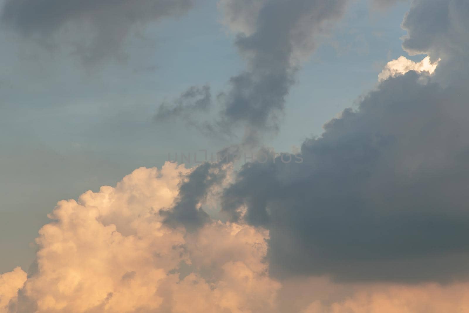 The cloudy beautiful sky with the light shining from the sun. The softness of the cloud creates a feeling of relaxation. copy space.