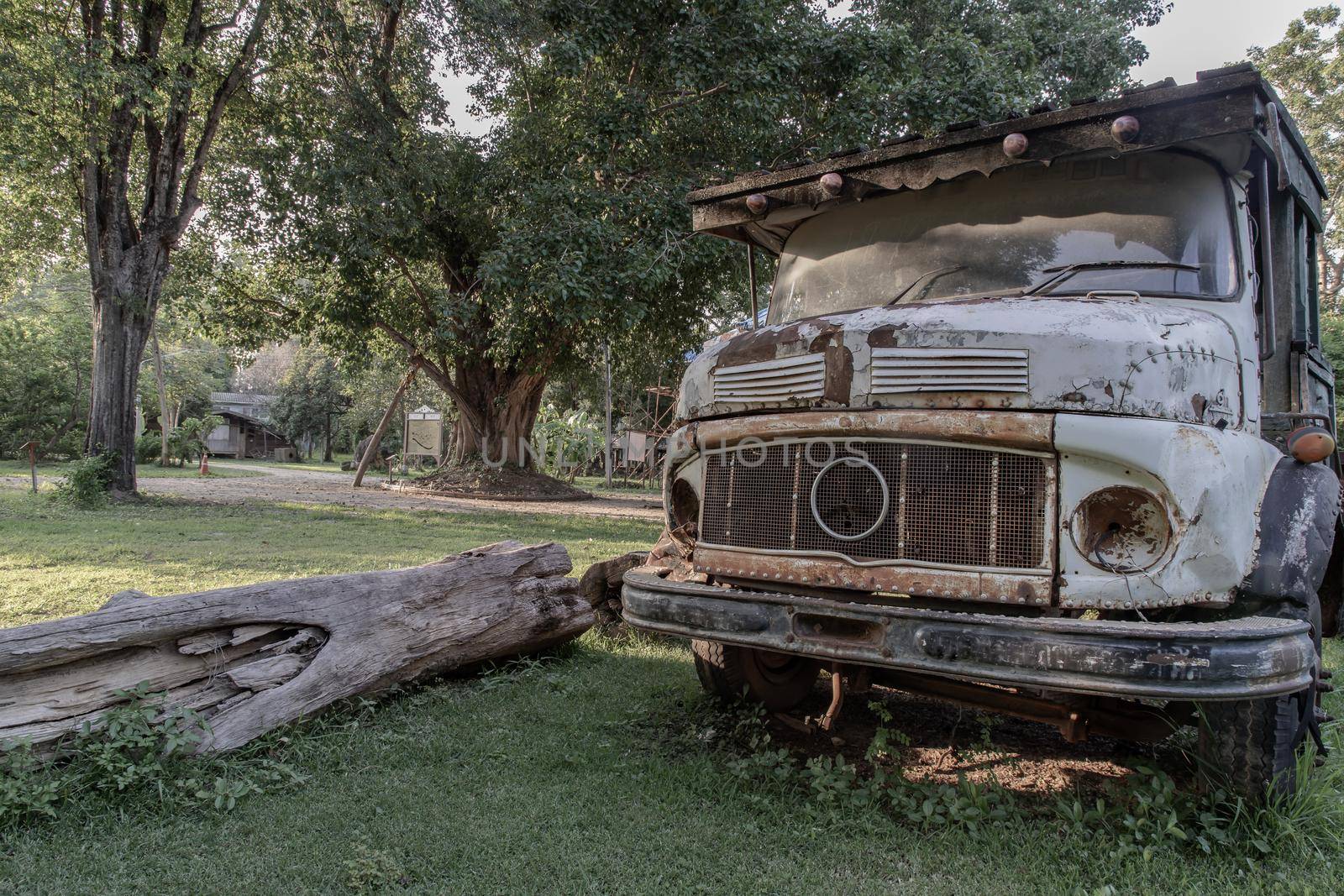 Rusty Old logging truck on old traditional farm area. Abandoned car, Selective focus.
