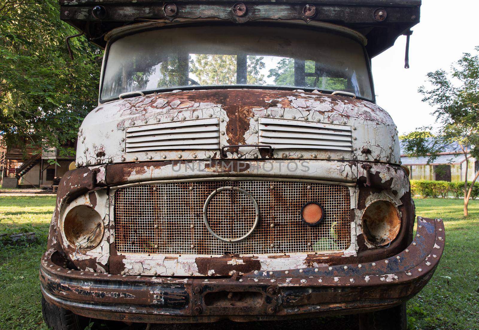Front view of Rusty old logging truck. Abandoned car, selective focus.