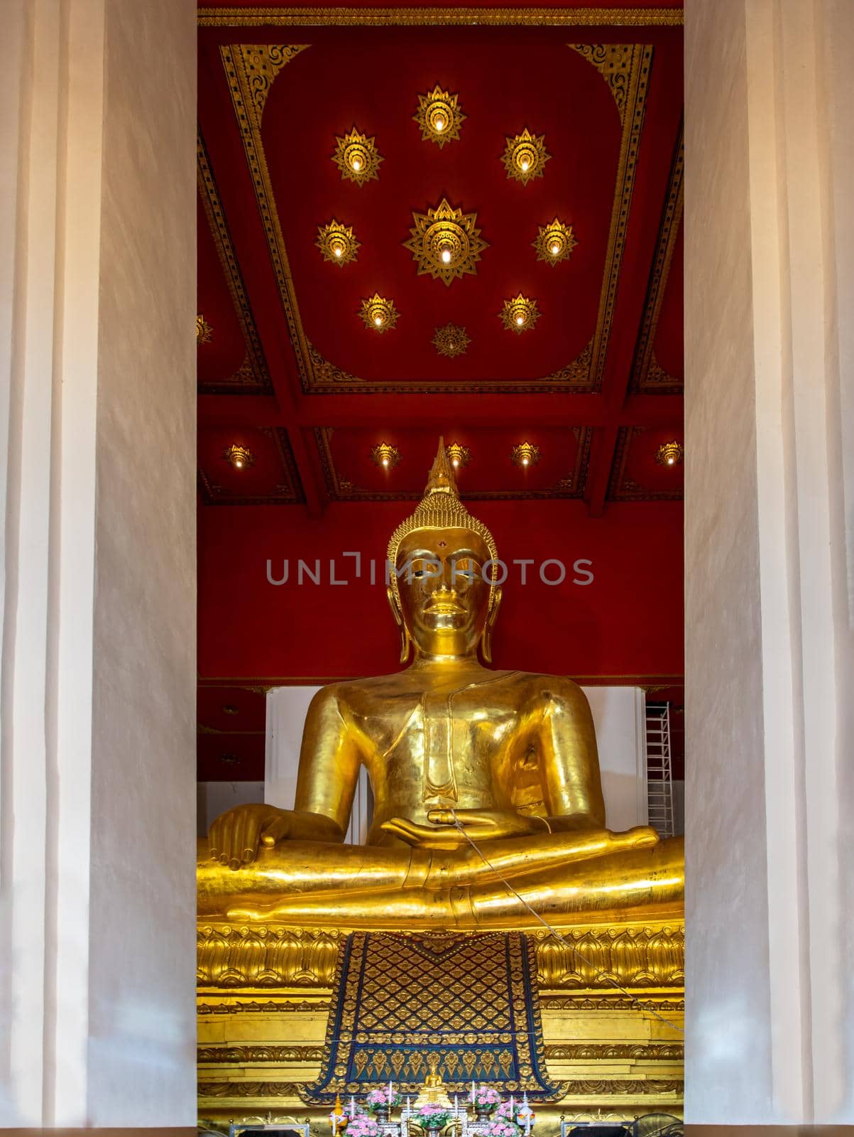 The buddha image in main vihan at Wihan Phra Mongkhon Bophit at Ayutthaya province of Thailand. Selective focus.