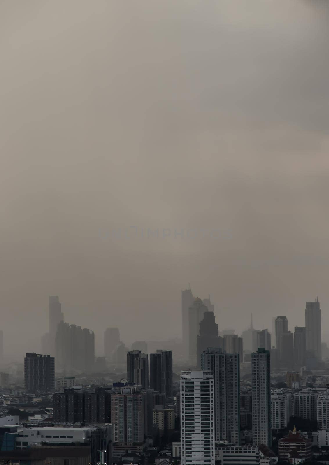 Bangkok, thailand - Nov 23, 2020 : View of Bangkok with city skyscrapers covered in a dense smog before a rain. Focus and blur.
