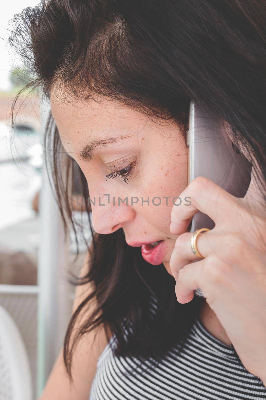 Brunette girl with a cell phone by germanopoli
