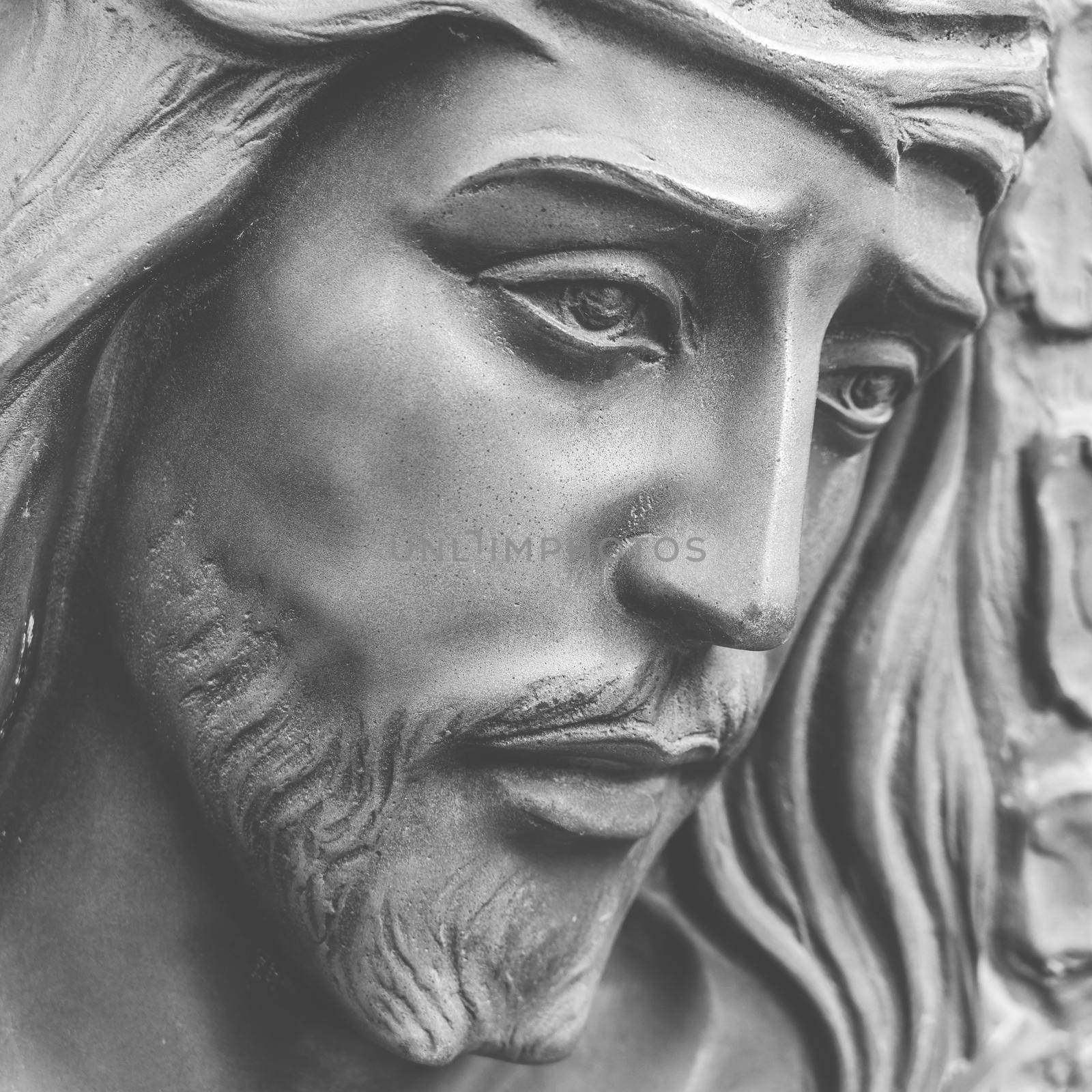Statue of the face of jesus with a crown of thorns. Close-up. Ideal for concepts or events like Easter.