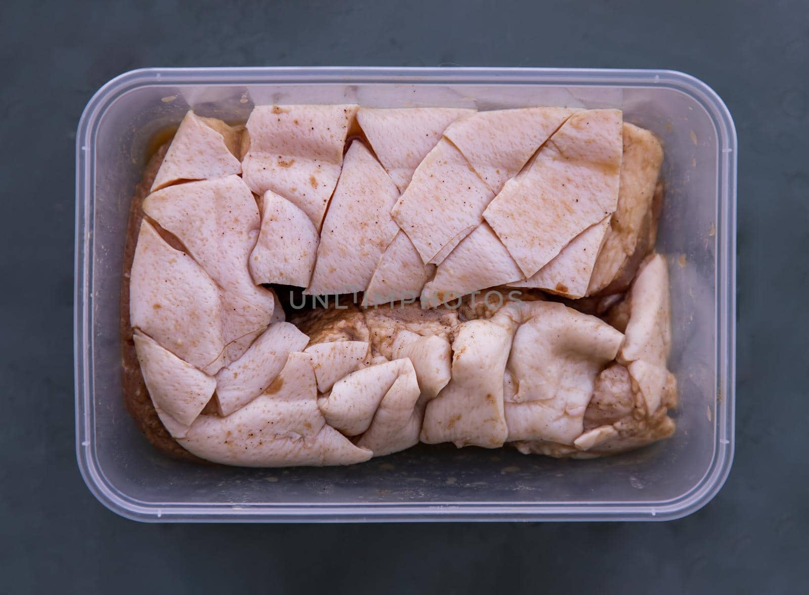 Raw pork belly portions, Marinated rolled pork belly ready for deep fried. Selective focus.