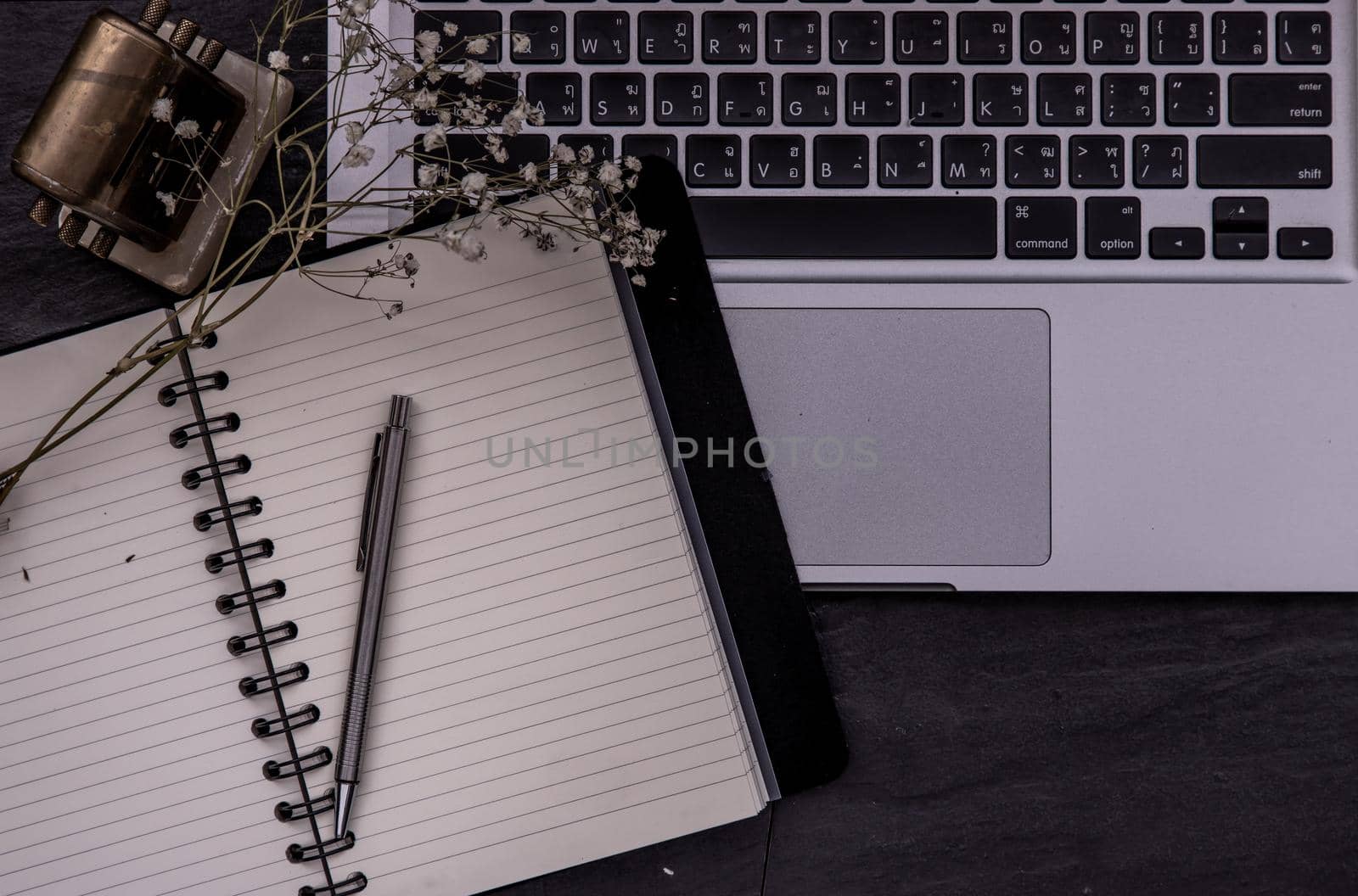 Open empty blank notebook organizer with pen for planning work on laptop, Concept for business. Planning or diary. Great for any use. Top view