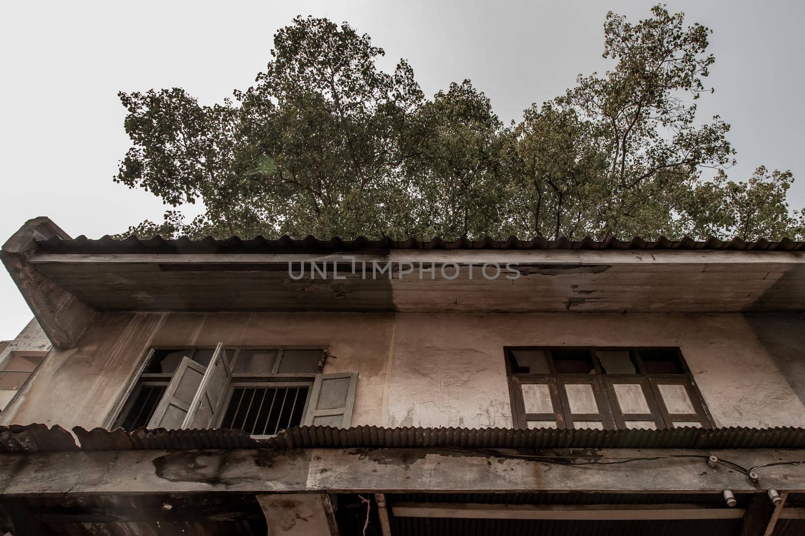Bangkok, Thailand - Jan 19, 2020 : External of old house was left to deteriorate over time, Chinese Architecture style, Abandoned house, Destroyed house.
