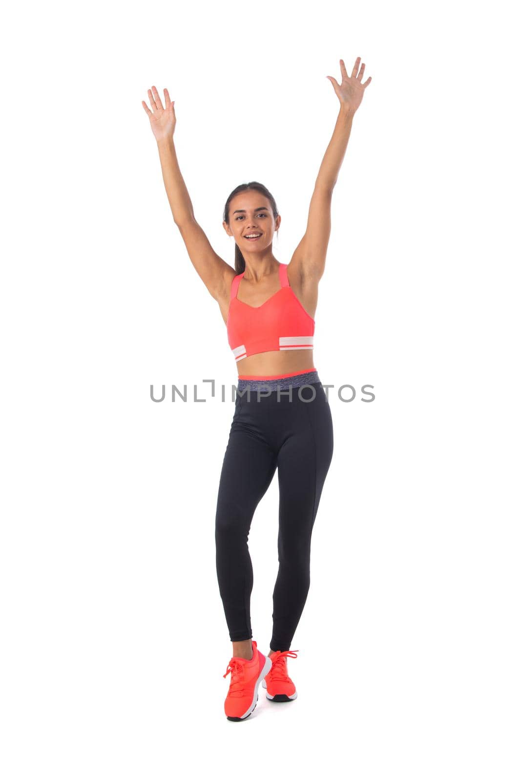 Fitness girl with arms raised by ALotOfPeople