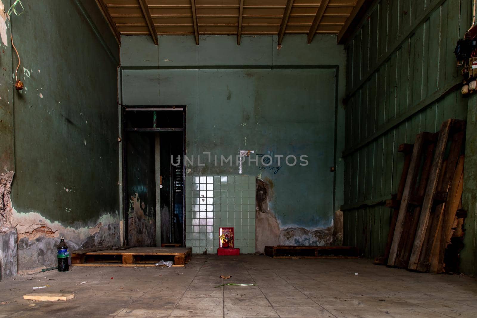 Bangkok, Thailand - Jan 19, 2020 : Old cement wall of Deteriorated abandoned old house, Destroyed house, Ruined house.