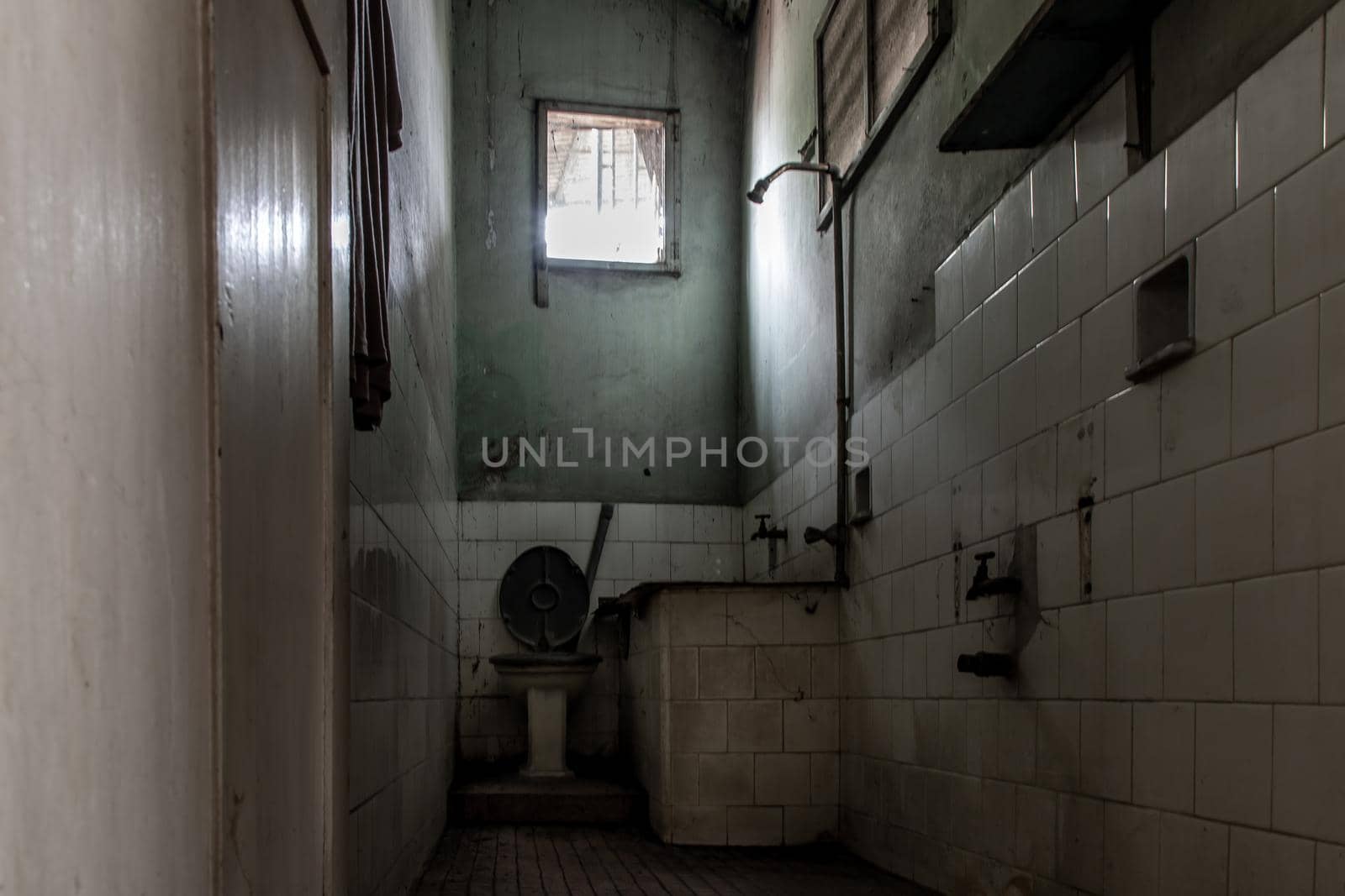 Bangkok, Thailand - Jan 19, 2020 : Abandoned old toilet to deteriorate over time, Abandoned house, Destroyed house, Ruined house.