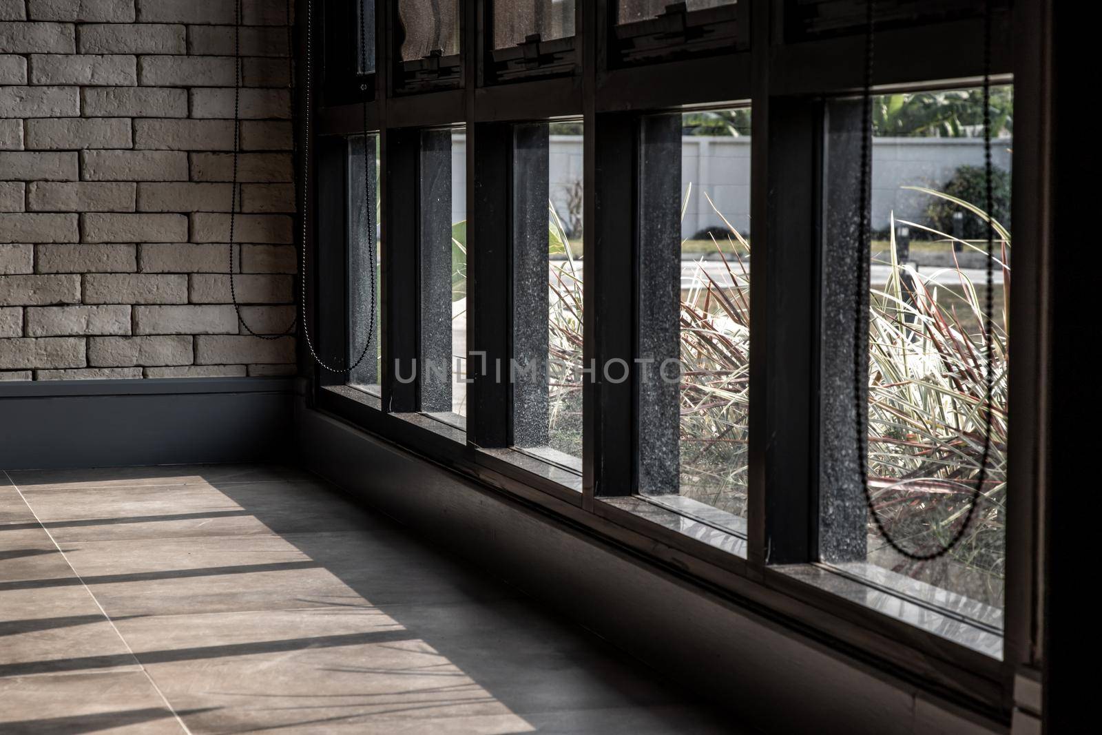 Sunlight shining into the empty loft style room, copy space.