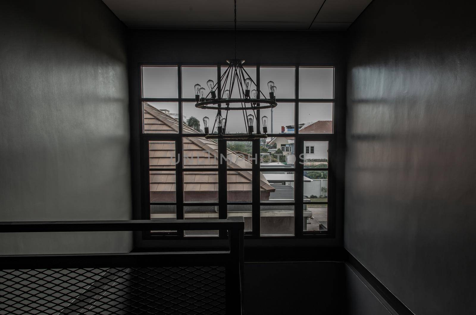 Bangkok, Thailand - 15 Dec 2019 : View of windows on a a stairway from 1st floor to 2nd floor in loft style home.