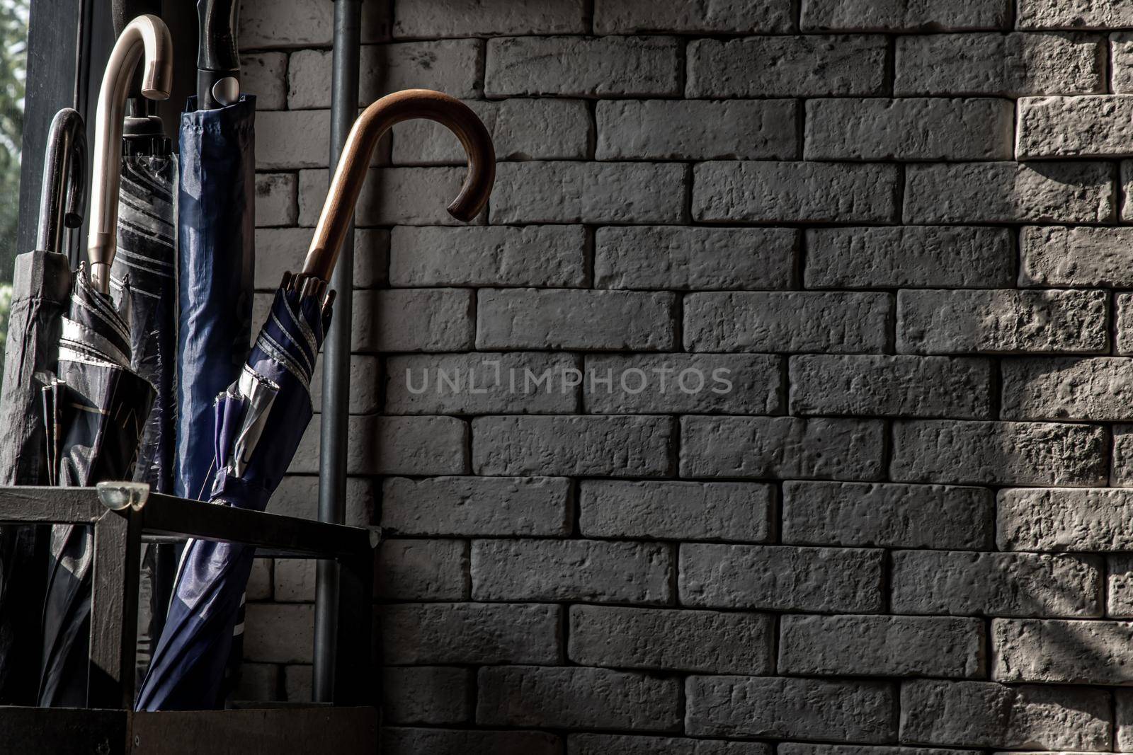 Bangkok, Thailand - 15 Dec 2019 : The sunlight shines on the Umbrella Stand Box in loft style home, Selective focus.
