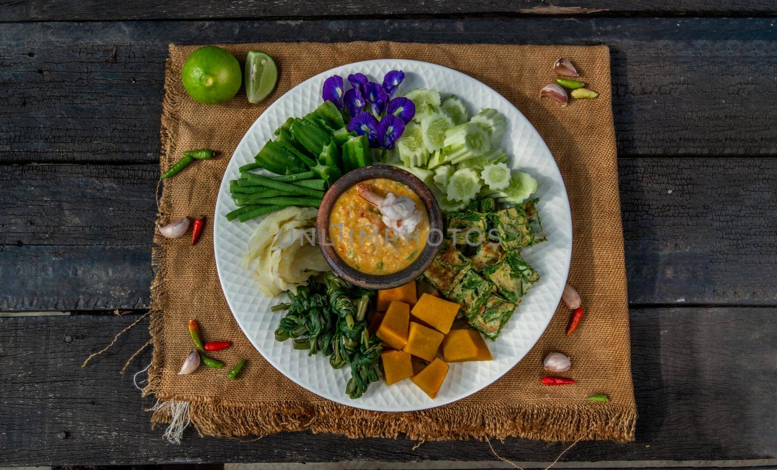 Thai Traditional Local Food : Shrimps chili dip or nam prik with shrimps (Nam Prik Goong Sod) with blanched vegetables and cha-om omelets.