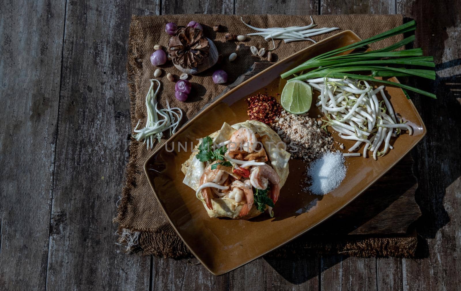 Fried Thai Noodle with Shrimp Wrapped in Egg (Pad Thai), That popular food for foreigner tourists, Top view.