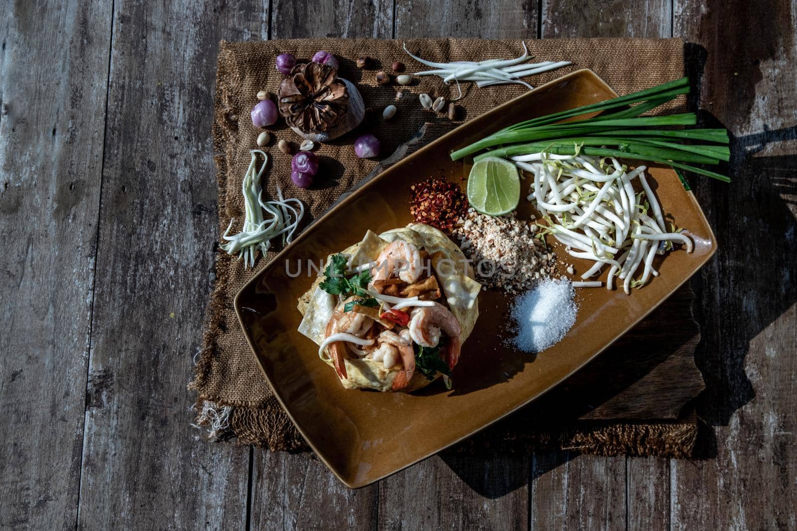 Fried Thai Noodle with Shrimp Wrapped in Egg (Pad Thai), That popular food for foreigner tourists, Top view.