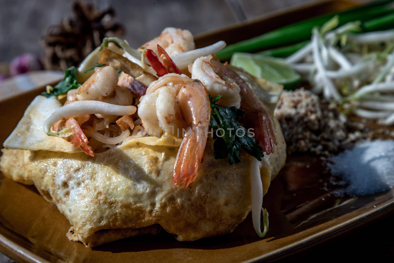 Close-up of Fried Thai Noodle with Shrimp Wrapped in Egg (Pad Thai), That popular food for foreigner tourists.