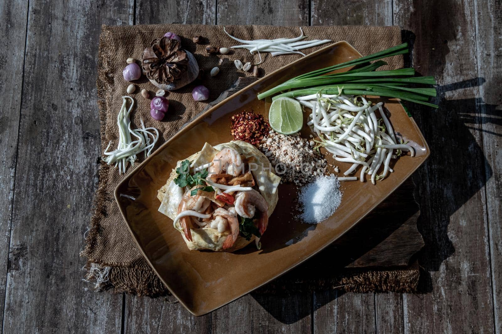 Fried Thai Noodle with Shrimp Wrapped in Egg (Pad Thai), That popular food for foreigner tourists, Top view.