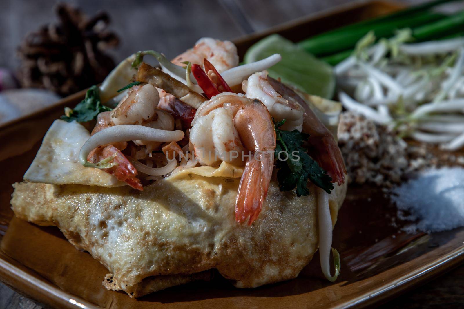 Close-up of Fried Thai Noodle with Shrimp Wrapped in Egg (Pad Thai), That popular food for foreigner tourists.